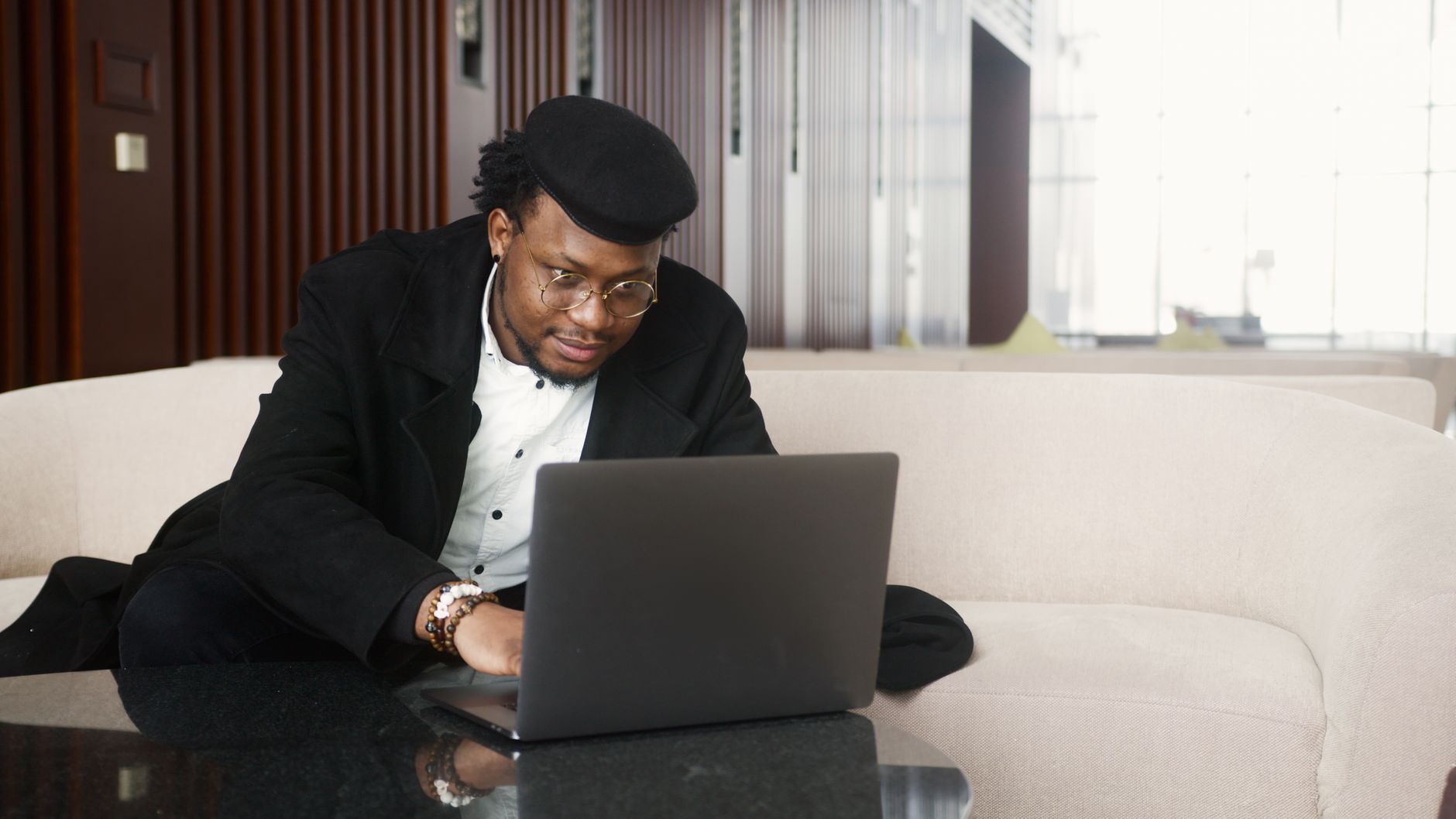 A focused auditor analyzing accounts on a laptop